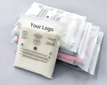 Stack of white packages with text and a logo on a gray background