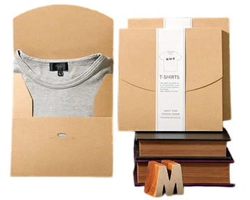 Cardboard packaging with a t-shirt and books on a white background