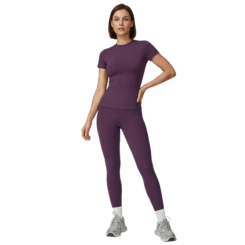Woman wearing a purple athletic outfit on a white background
