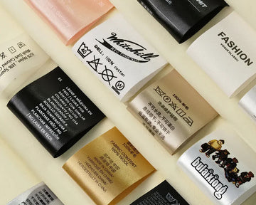 Collection of various fabric labels on a beige background